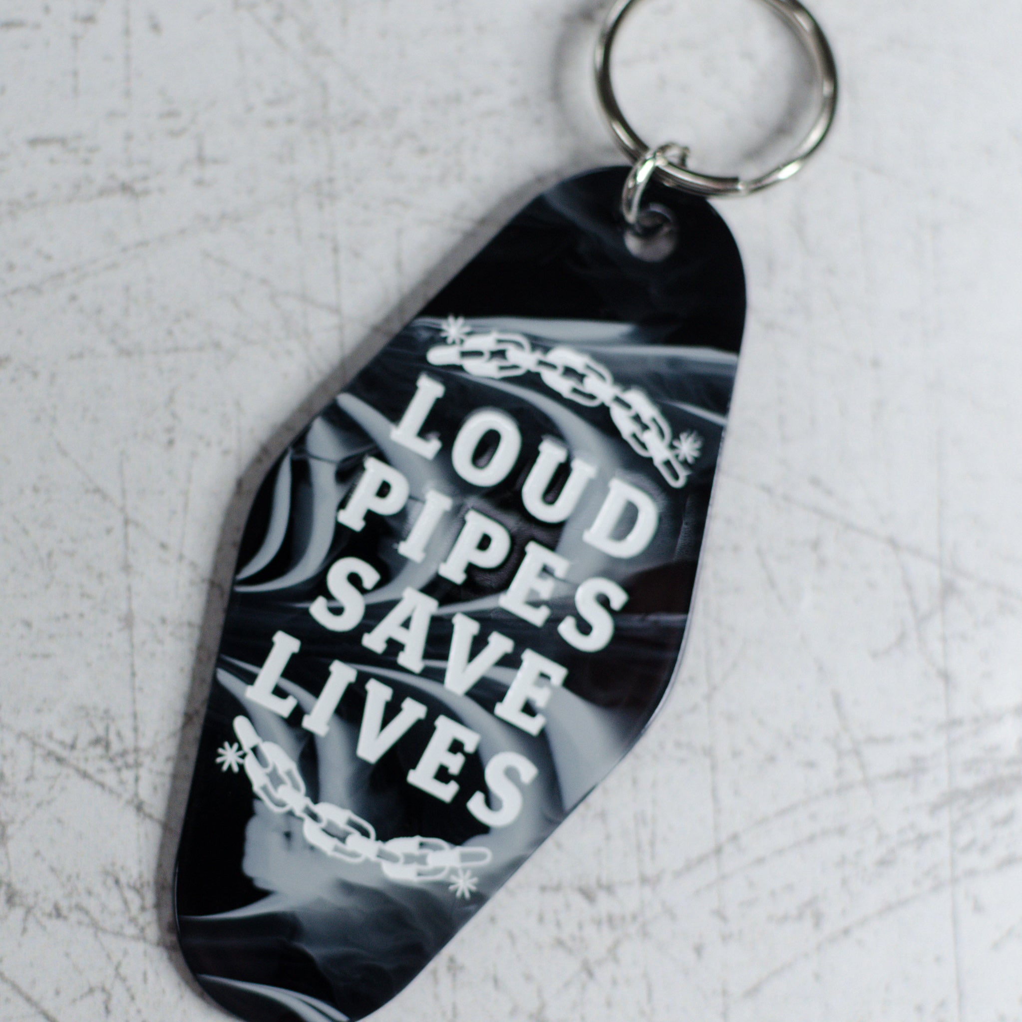 Loud Pipes Save Lives Motel Keychain Angled View