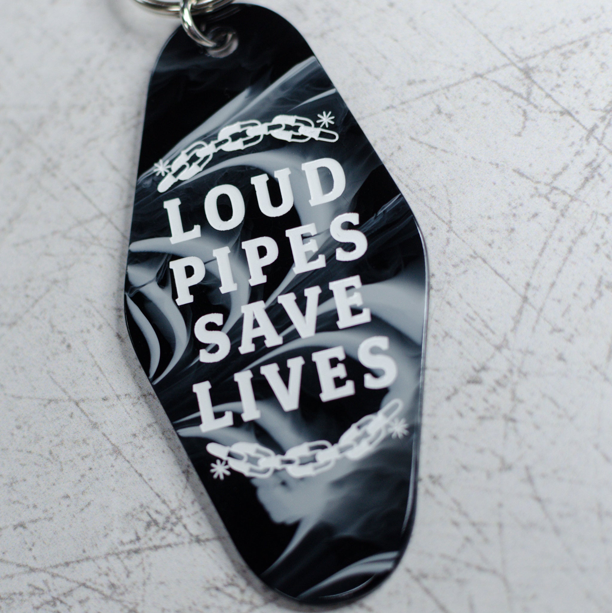 Loud Pipes Save Lives Motel Keychain Close Up View