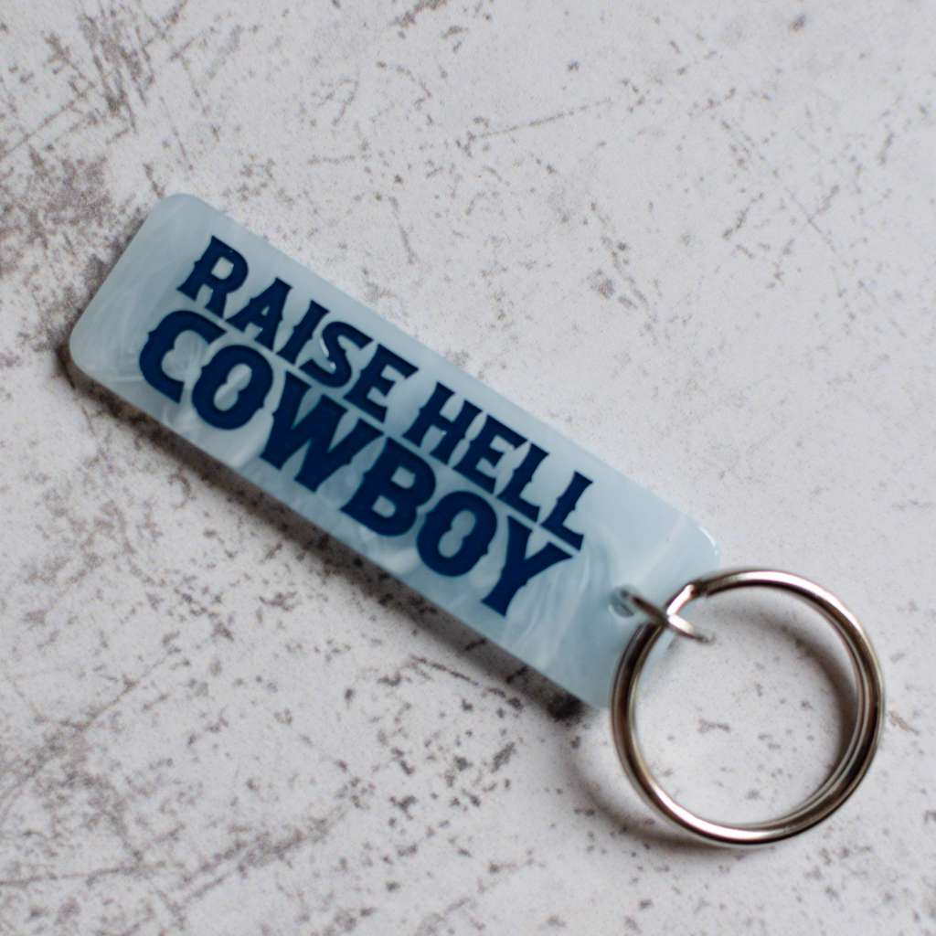 Raise Hell Cowboy Blue Keychain Front View