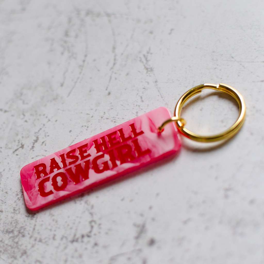 Raise Hell Cowgirl Pink Keychain Angled View