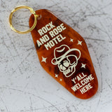 Rock And Rose Motel Keychain In A Motel Key Style Angled View