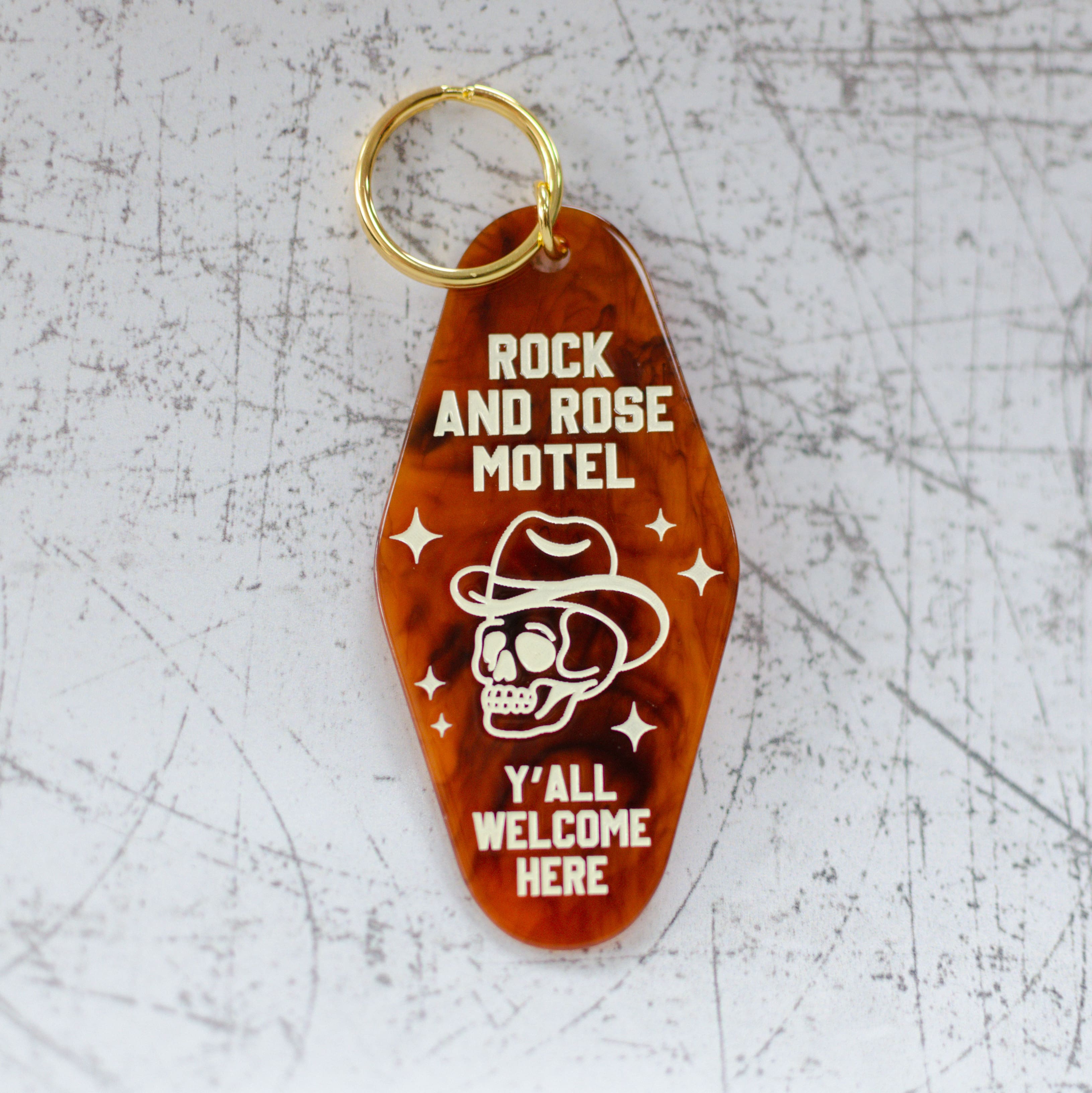 Rock And Rose Motel Keychain In A Motel Key Style Front View