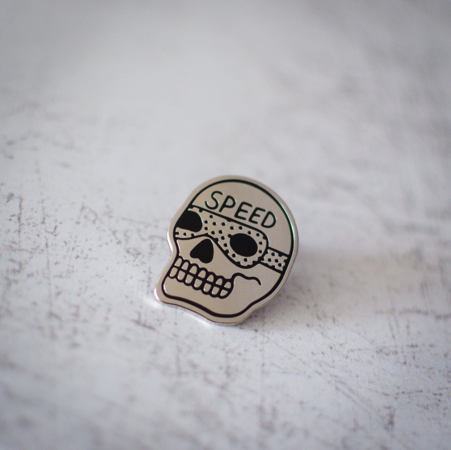 American Traditional Speed Skull Design Enamel Pin Close Up