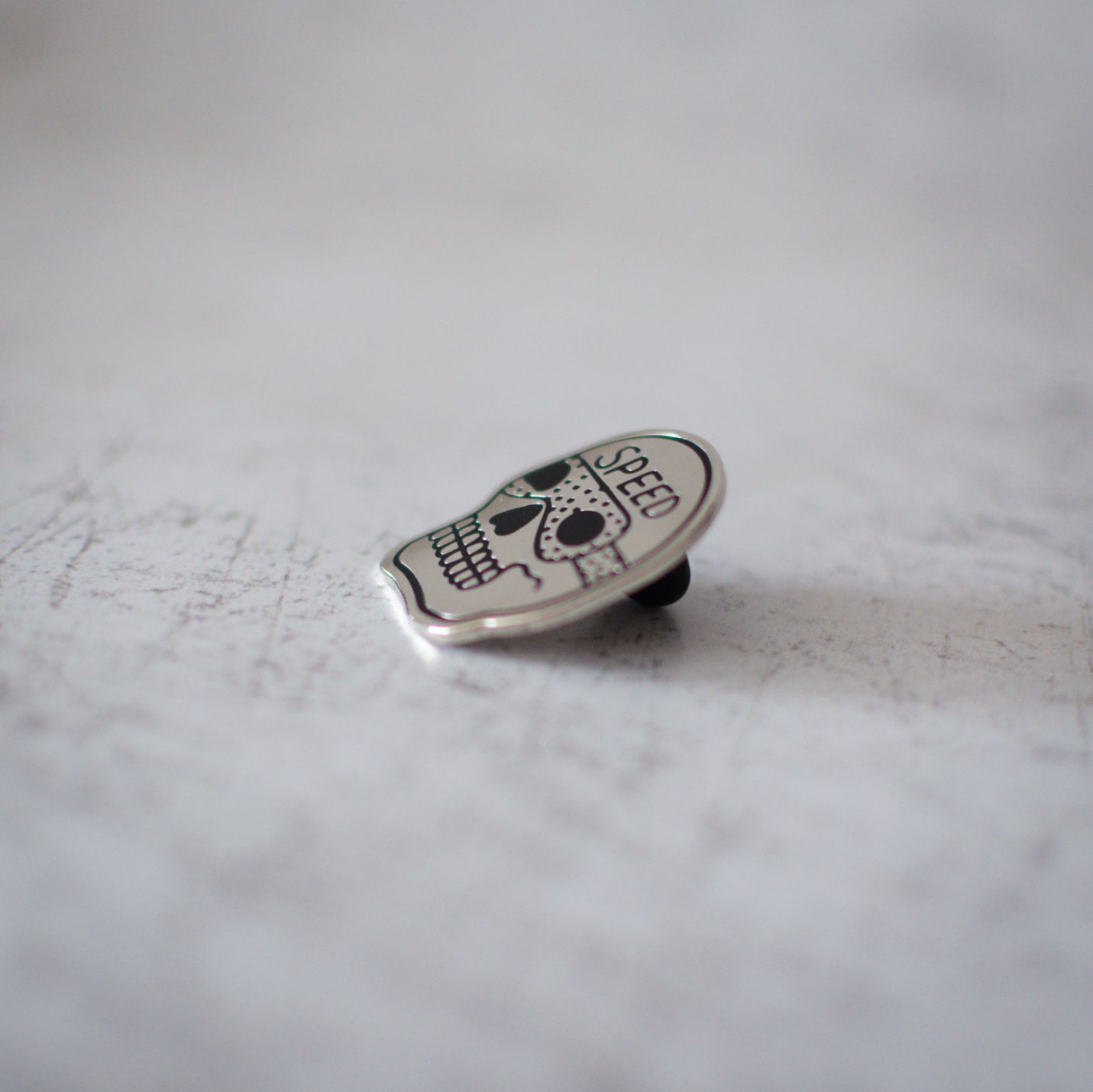 American Traditional Speed Skull Design Enamel Pin Side View