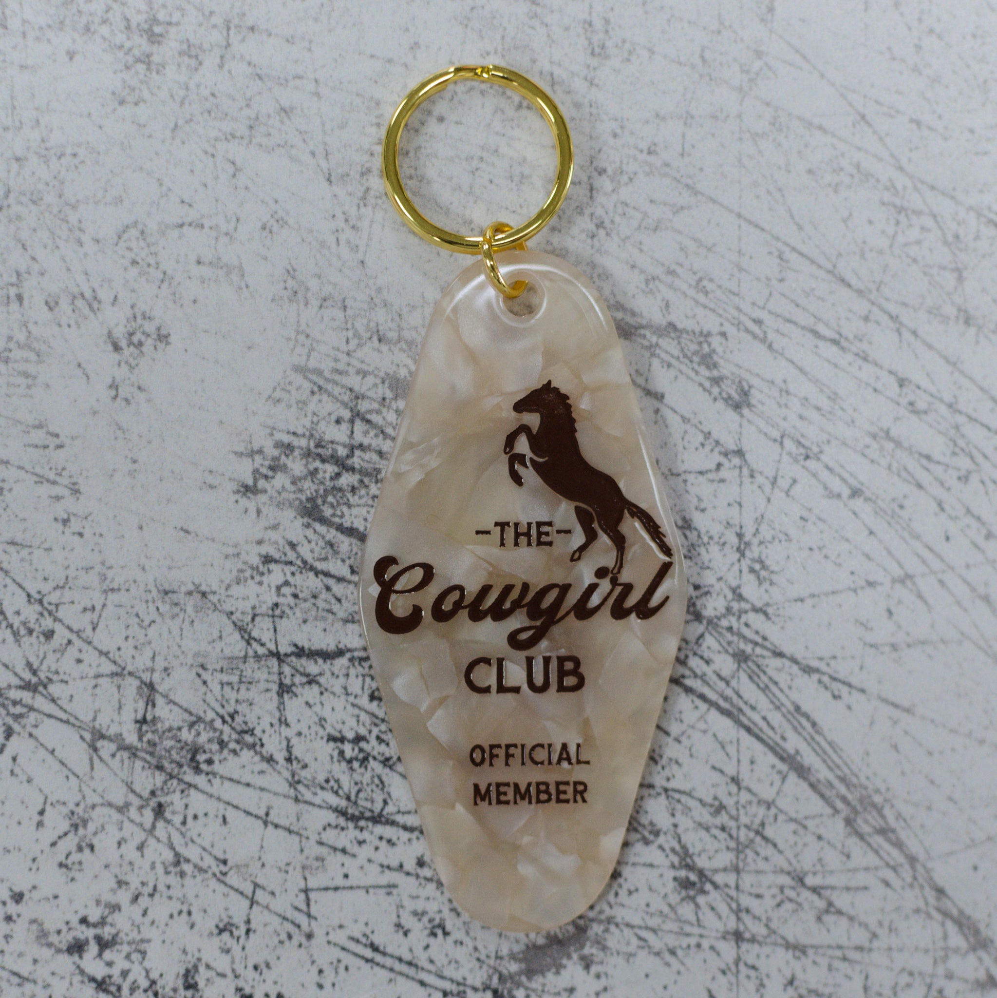 The Cowgirl Club Official Member Keychain Front View