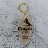 The Cowgirl Club Official Member Keychain Front View