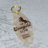 The Cowgirl Club Official Member Keychain Angled View
