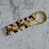 Save A Horse Ride A Cowboy Cow Print Keychain Close Up