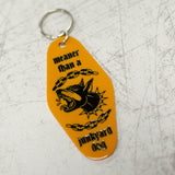 Meaner Than A Junkyard Dog Orange Keychain Close Up View