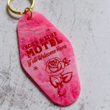 Pink Rock And Rose Motel Keychain With Rose Logo Close Up View